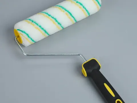 7 inch acrylic paint roller with yellow and green striped cover and black handle