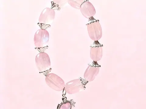 Blossom Sync rose quartz crystal bracelet, close view of the beads