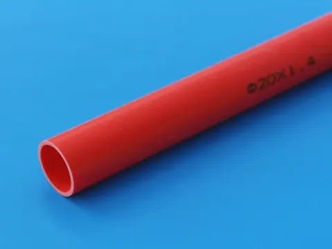 Red PVC electrical conduit marked with the 20 mm diameter and wall thickness