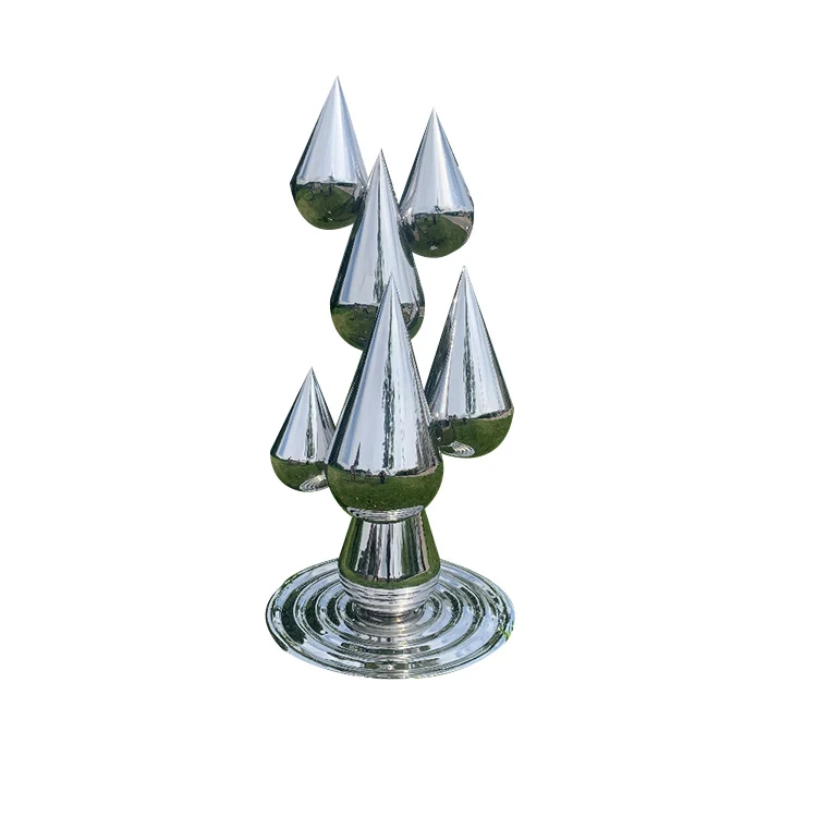 Polished stainless steel sculpture of multiple droplet shapes on a rippled circular base, white background