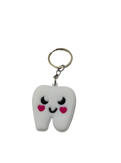 Smiling Tooth Soft PVC Keychain showing a smiling white tooth