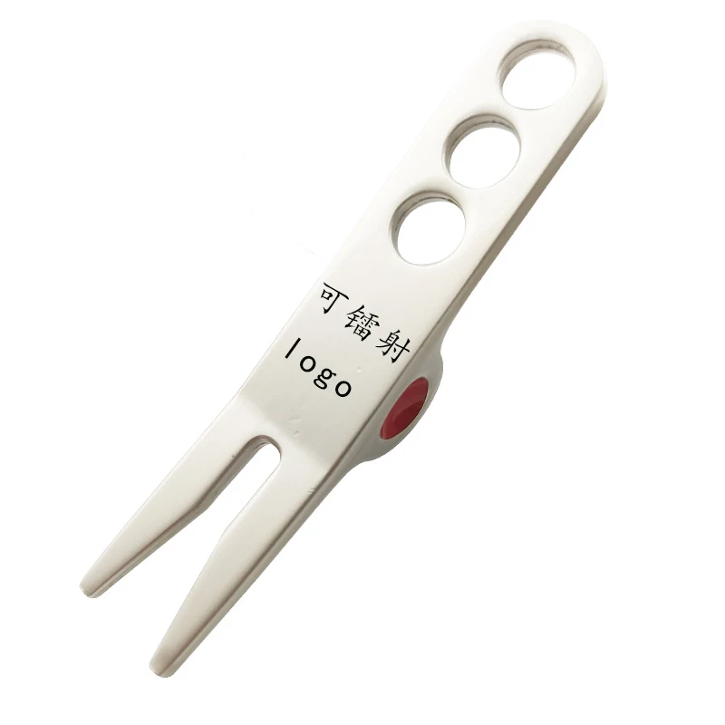 Aluminium divot tool shown from the side