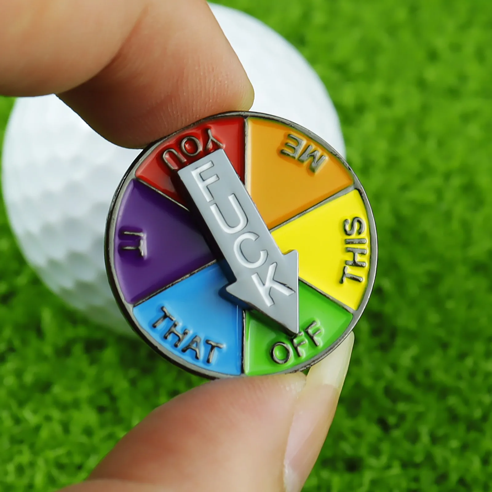 Rotating golf ball marker shown from the reverse