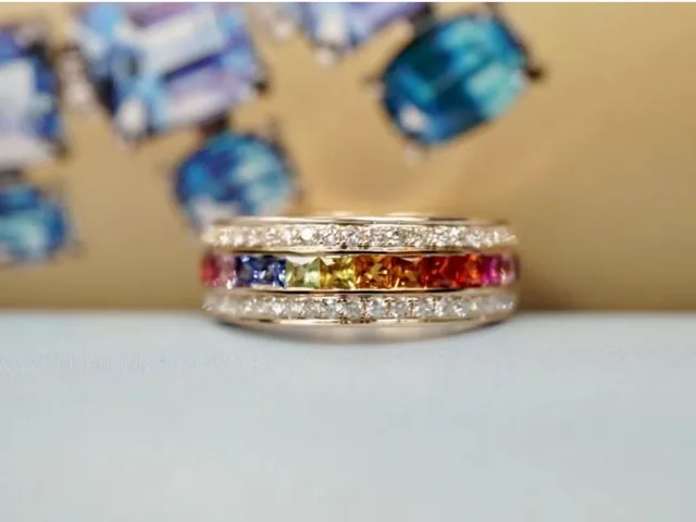 A setter placing coloured sapphires into a ring at the BH Jewelry bench