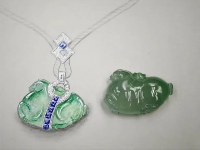 A jadeite pendant with diamond accents laid out for inspection at BH Jewelry