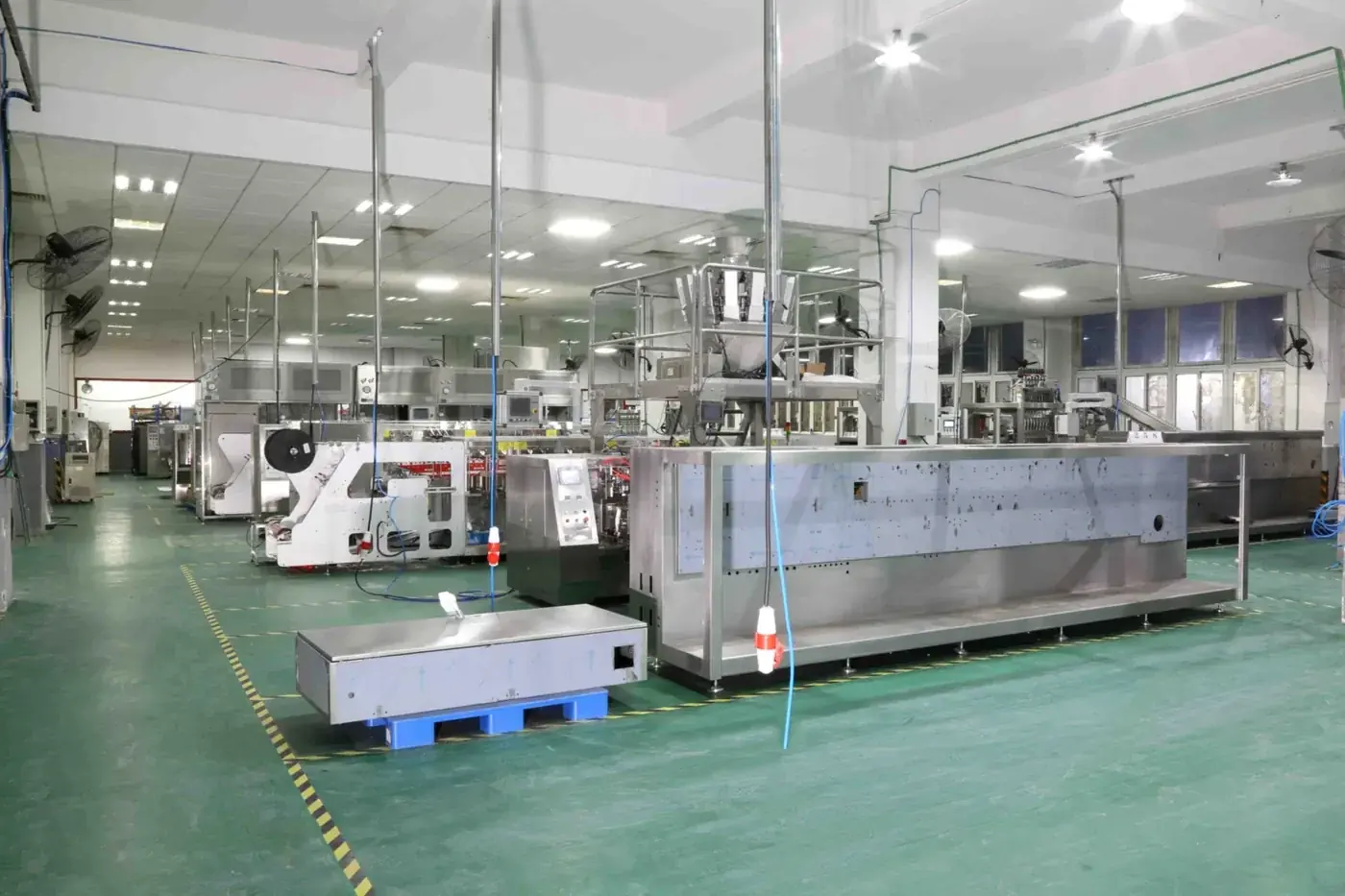 Finished Boevan packing machines lined up in the Shanghai workshop before shipment