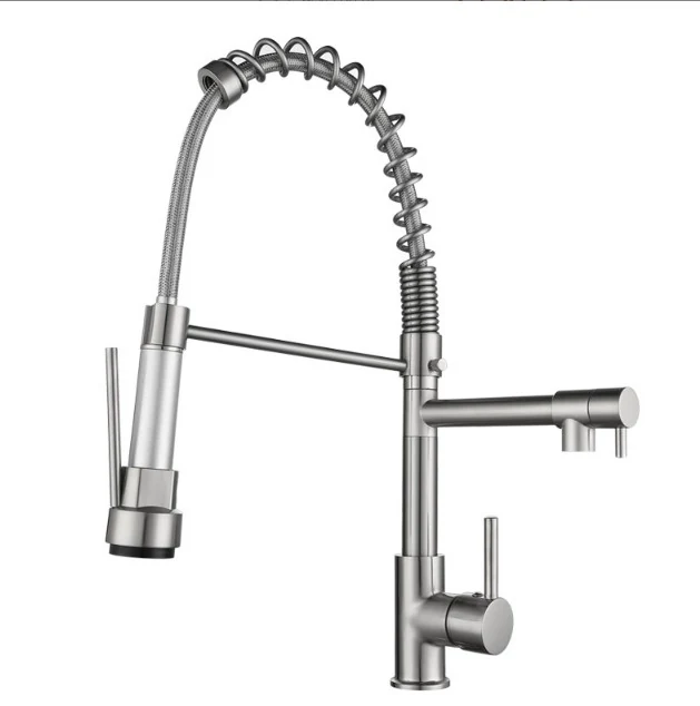 Spring arm kitchen faucet shown with the spray head extended