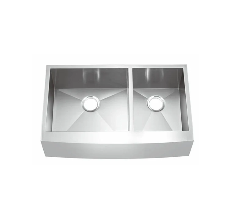 Double bowl apron sink viewed from the front showing the exposed apron face