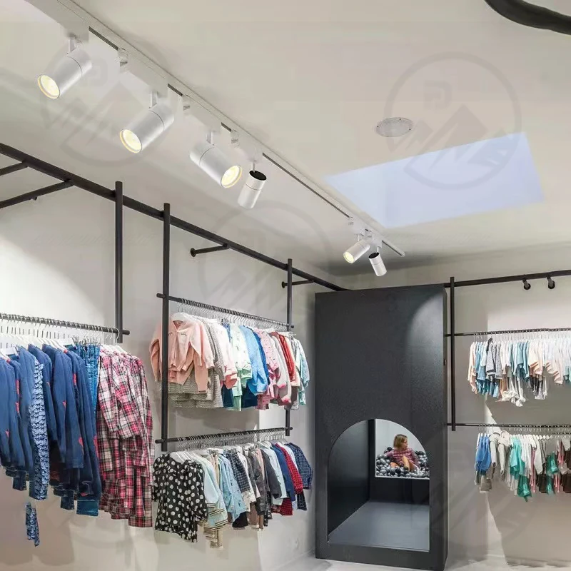 Surface LED down light with black finish installed on a ceiling