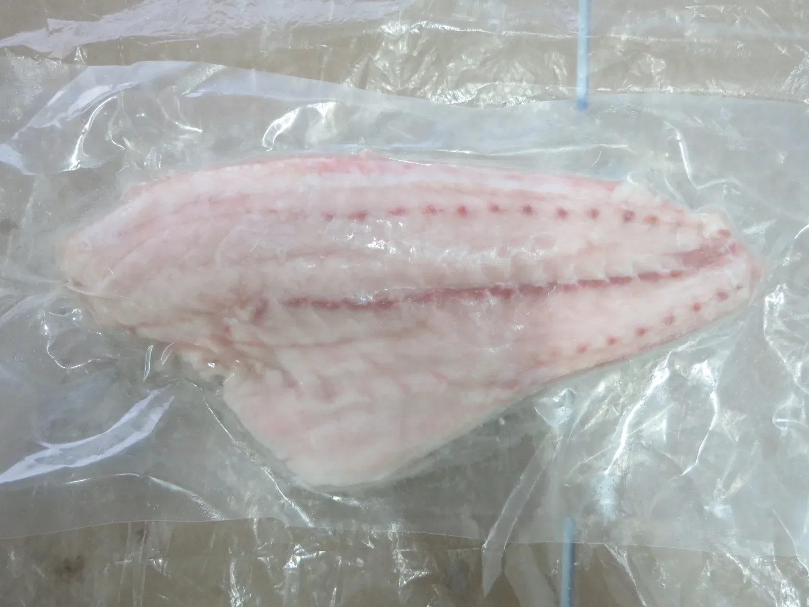 Skinless red drum fillet showing pale even flesh colour