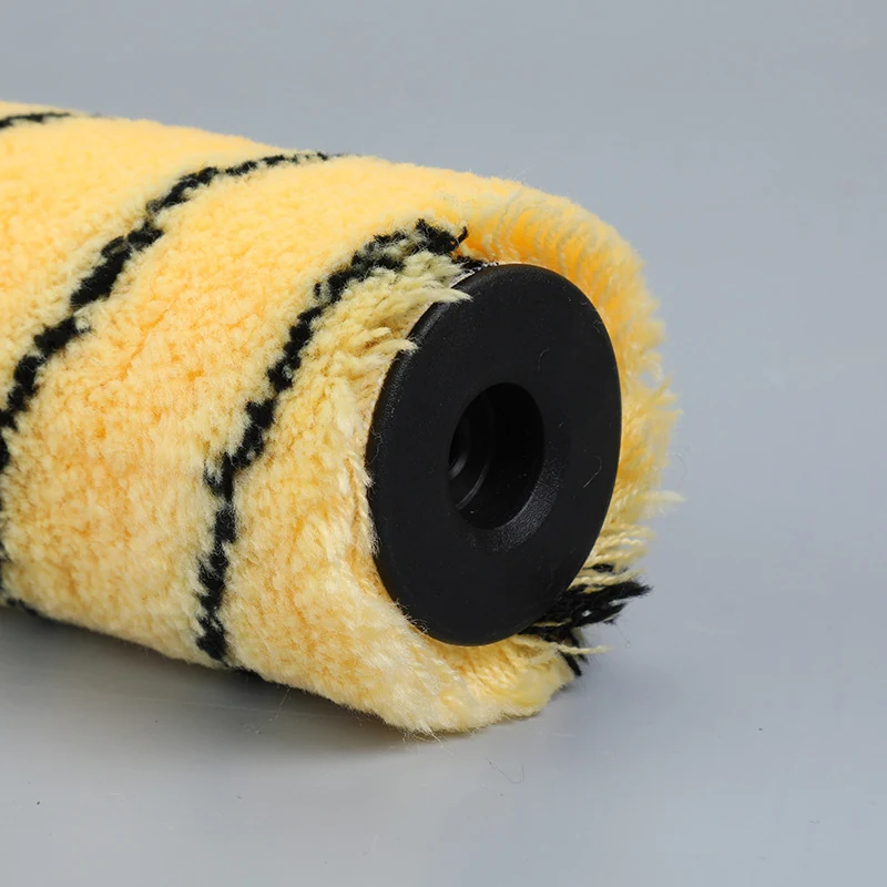 Close-up of yellow tiger stripe acrylic paint roller cover with black plastic end cap