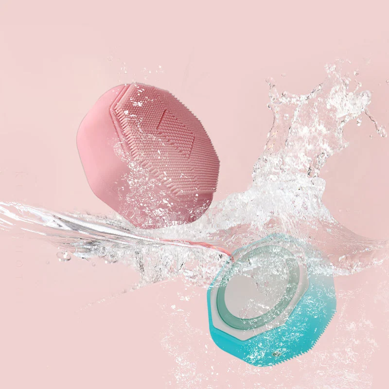 Silicone facial brush shown with USB cable and colour box packaging