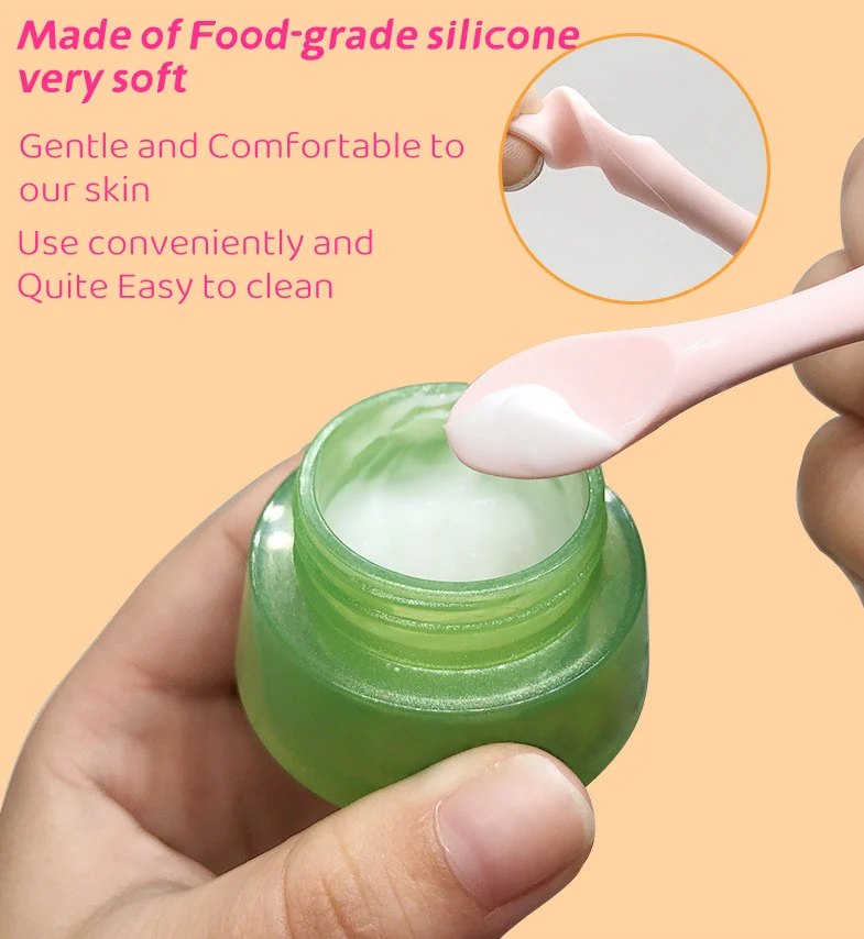 Close-up of the silicone spoon end and massage stick tip on the eye area