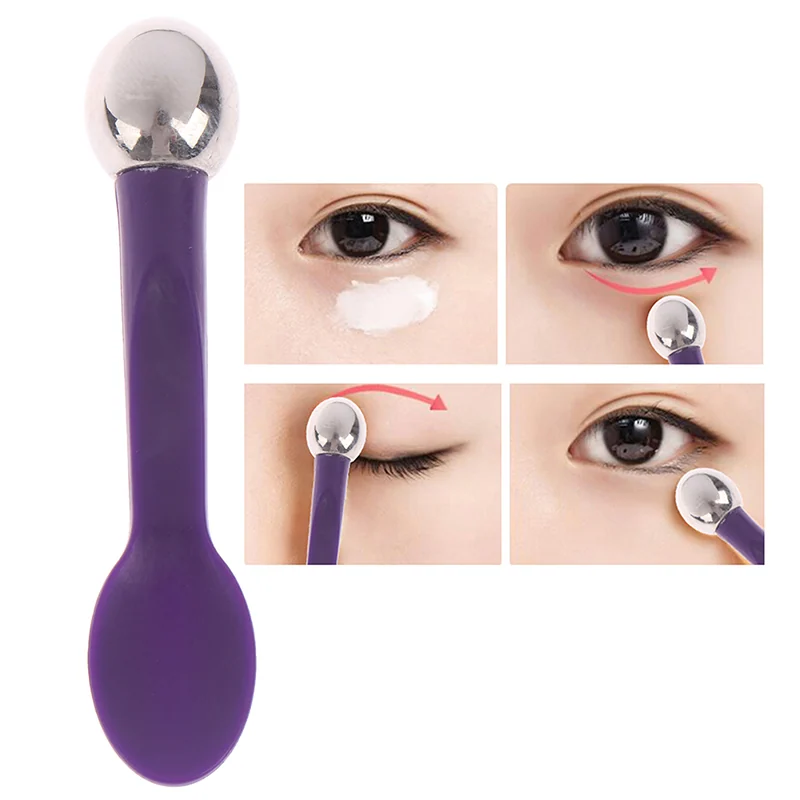 Eye massage stick in hand with metal head and custom logo visible