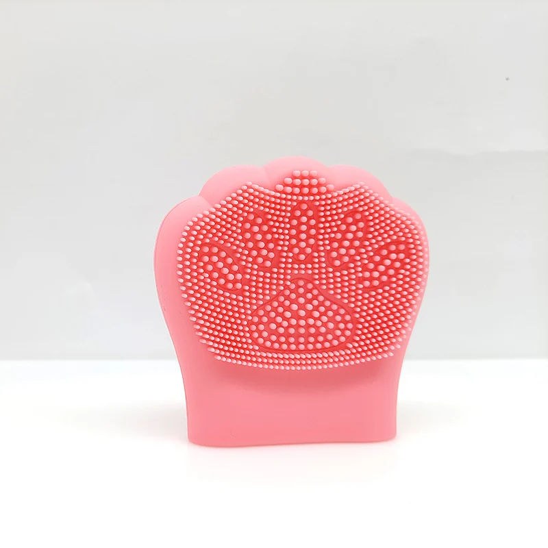 Silicone pore scrubber brush displayed on a clean surface with packaging options