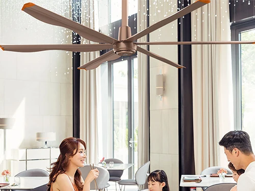Café seating area with commercial ceiling fans above the tables