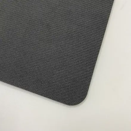 Edge of the counter mat showing the sealed PVC and rubber construction