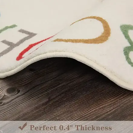 Round letter rug shown on a bedroom floor