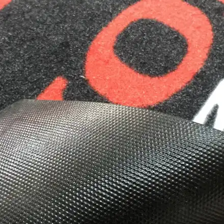 Close view of the printed carpet pile and rubber edge