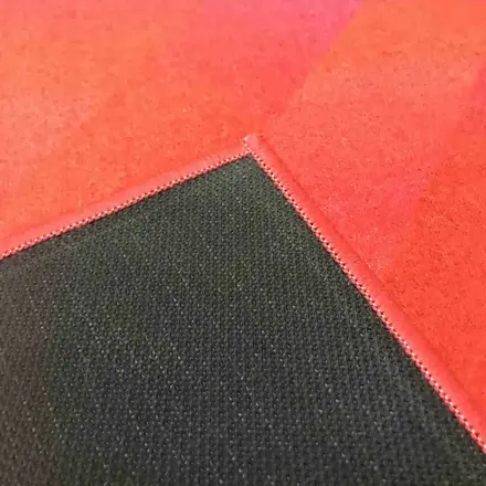 Rolled pit mat showing the TPR rubber backing