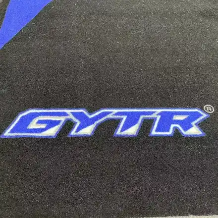 Underside of the motorcycle mat showing anti-slip nitrile rubber backing