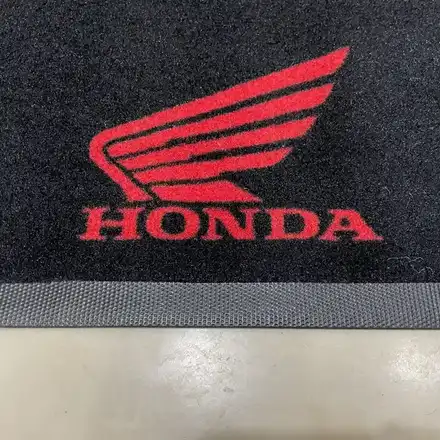 Motorcycle parked on the washable work mat