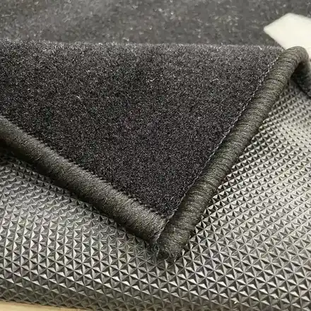 Anti-slip rubber backing on the reverse of the parking mat