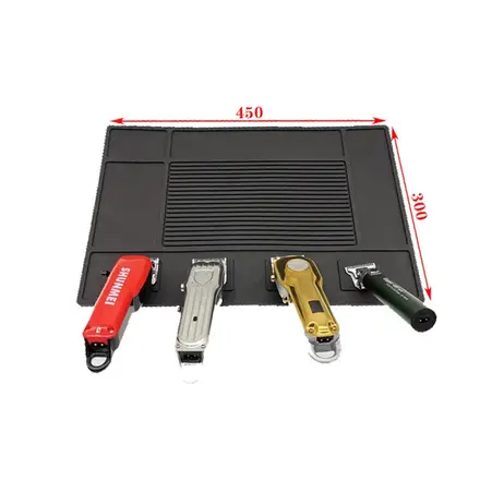 Station pad shown with salon tools arranged in the moulded compartments