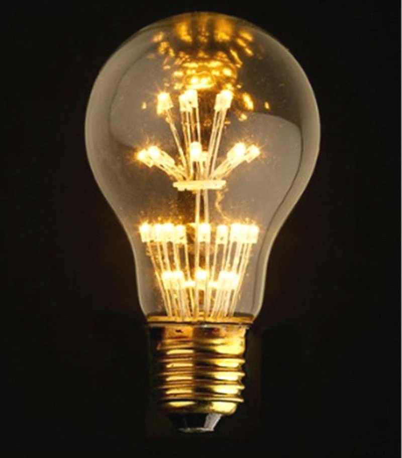 Vintage LED filament bulb lit at full output against a dark background