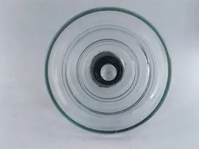 U120B toughened glass insulator of the type used in substation strain assemblies