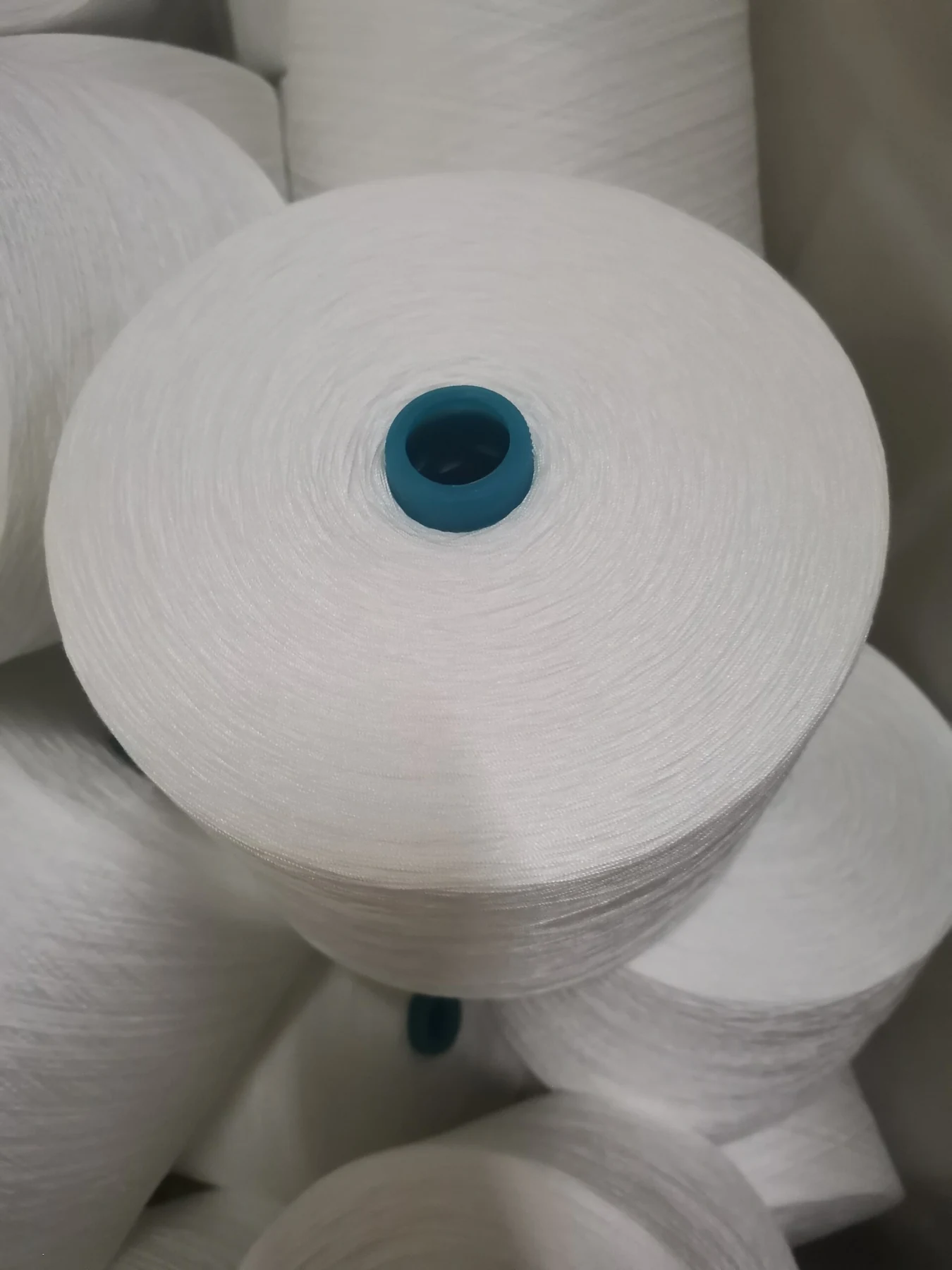 100% Spun Polyester Yarn 20S/2 on cone at the Hubei HuiLai Textile mill