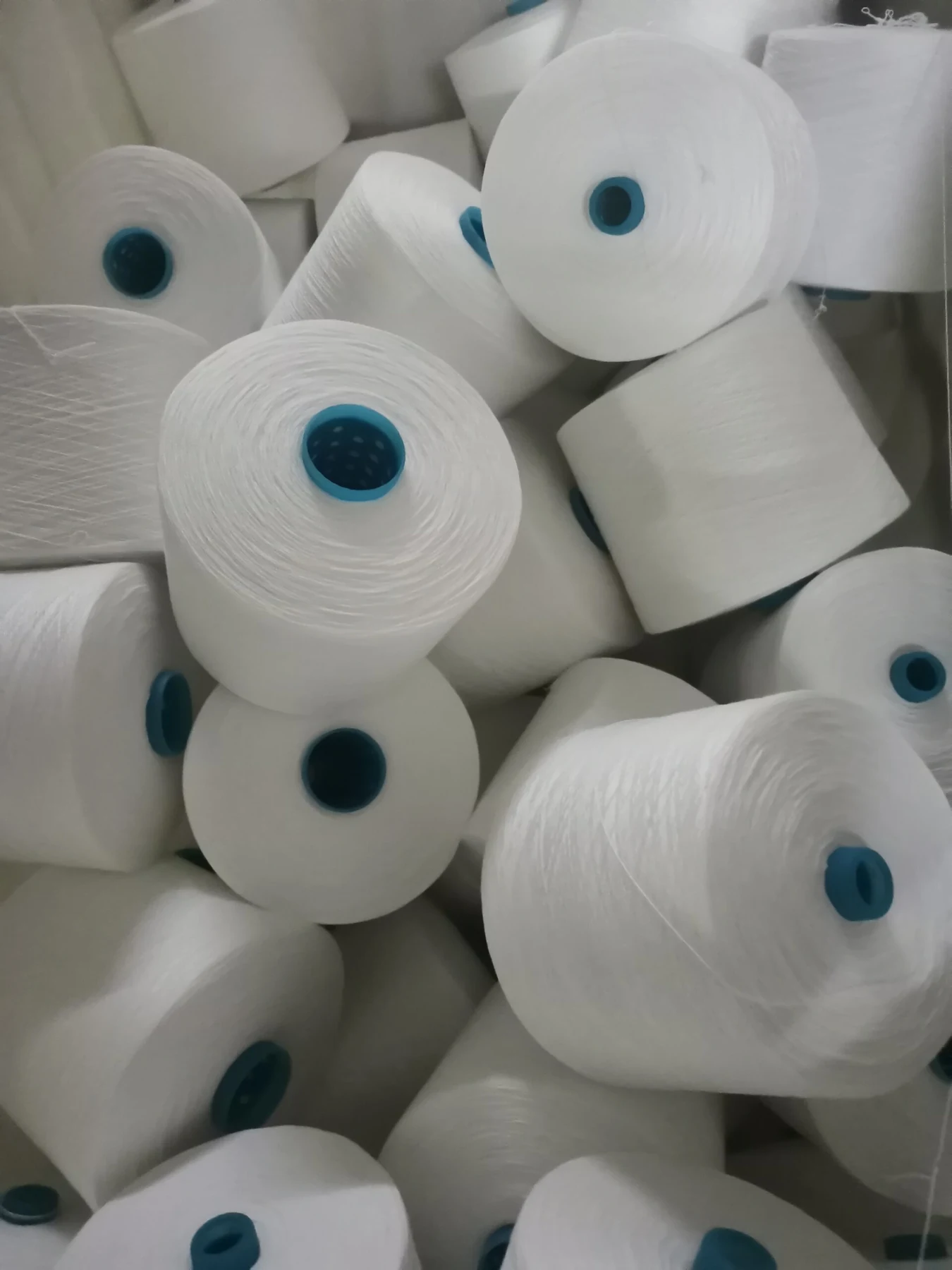 100% Spun Polyester Yarn 20S/3 on cone at the Hubei HuiLai Textile mill