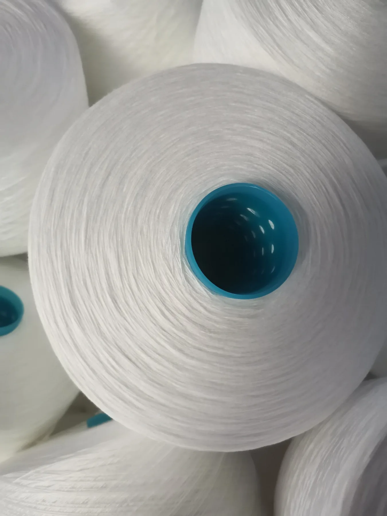 100% Spun Polyester Yarn 20S/4 on cone at the Hubei HuiLai Textile mill