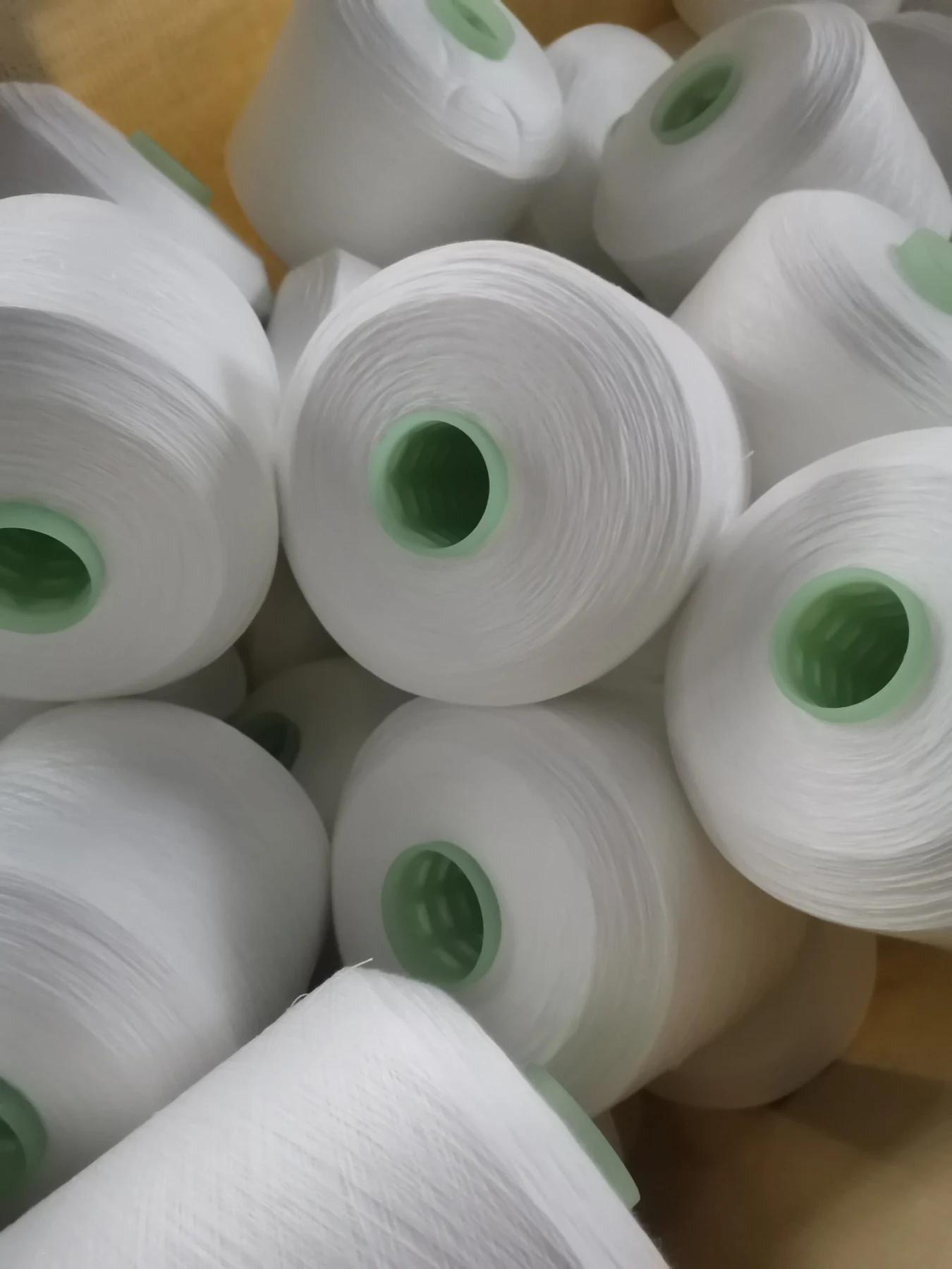 100% Spun Polyester Yarn 30S/2 on cone at the Hubei HuiLai Textile mill