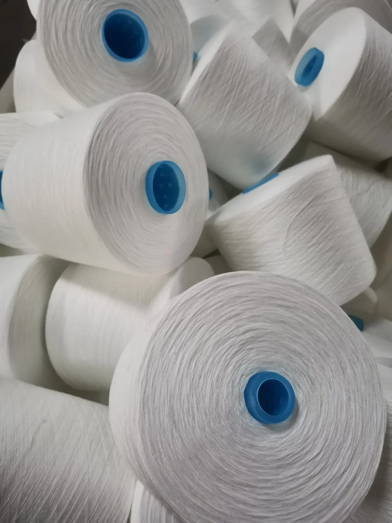 100% Spun Polyester Yarn 40S/3 on cone at the Hubei HuiLai Textile mill