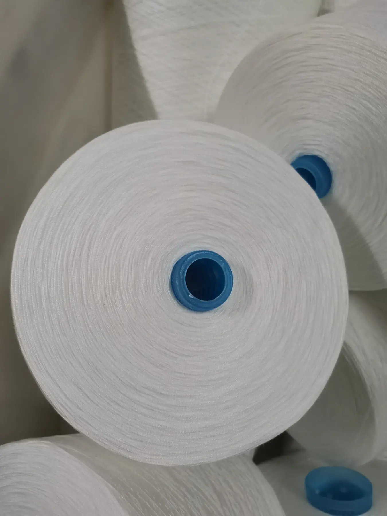 100% Spun Polyester Yarn 42S/2 on cone at the Hubei HuiLai Textile mill
