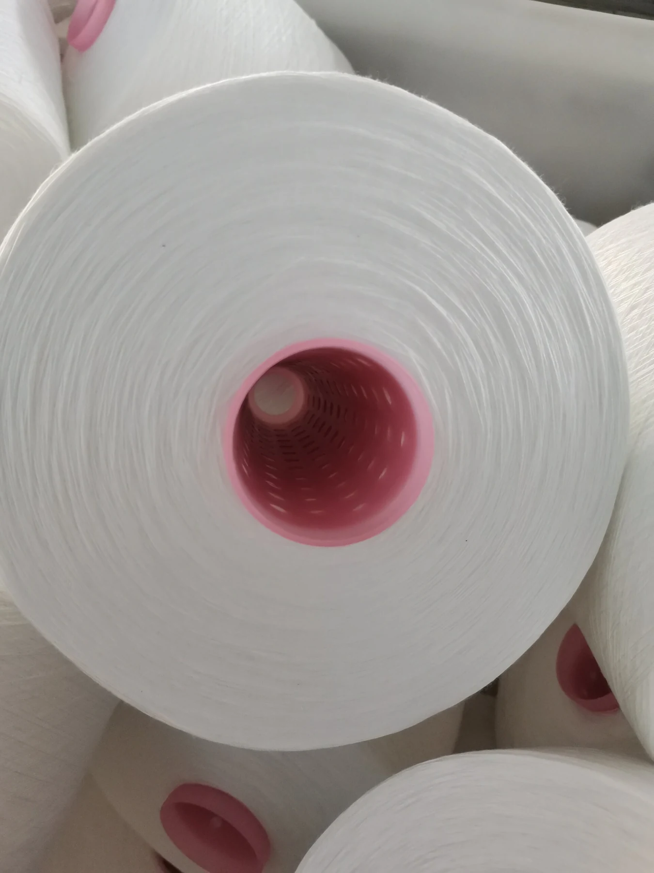 100% Spun Polyester Yarn 50S/2 on cone at the Hubei HuiLai Textile mill