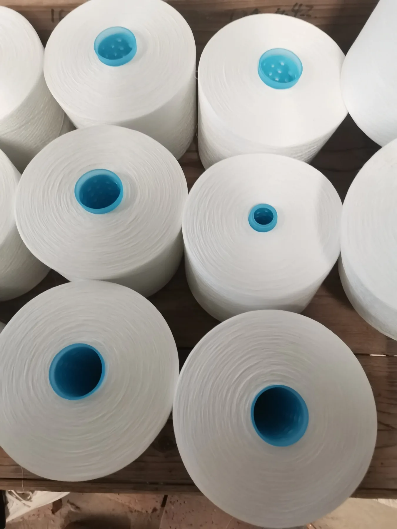 100% Spun Polyester Yarn 60S/2 on cone at the Hubei HuiLai Textile mill