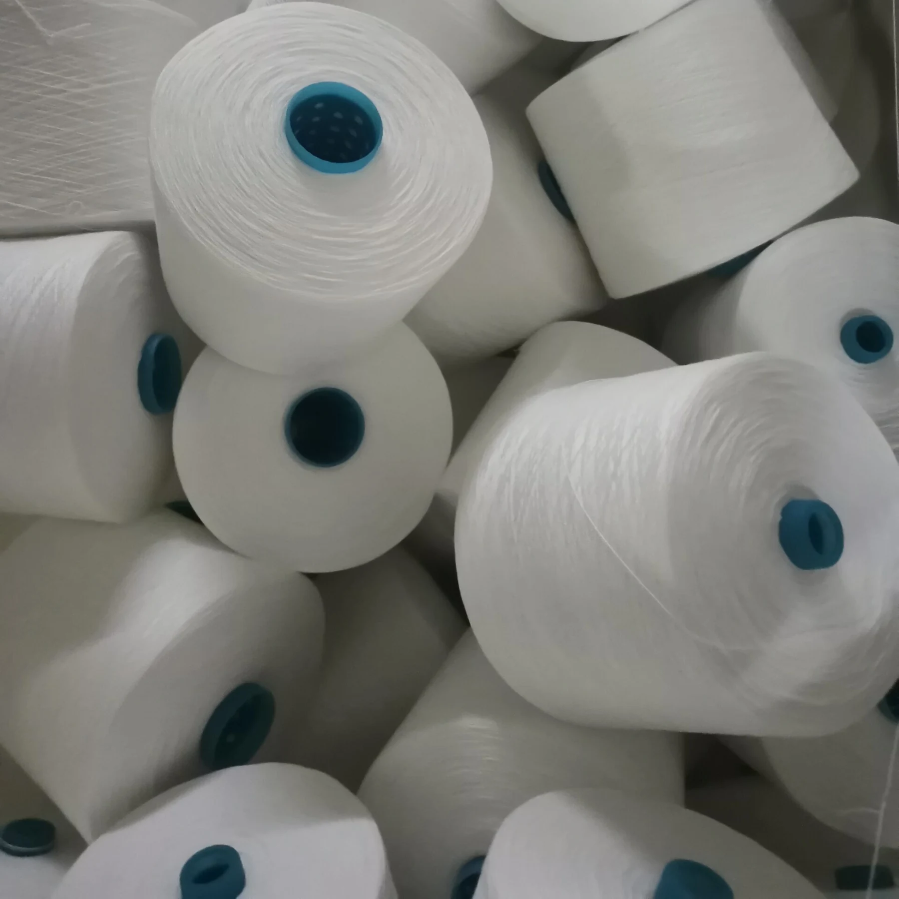 Spun polyester yarn cones in the warehouse