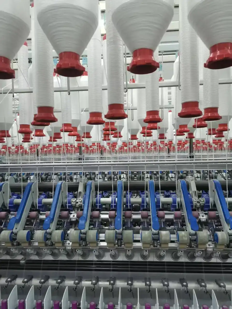 Ring spinning frames running inside the air conditioned workshop