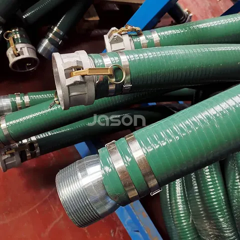 Green suction hose coils stacked for dispatch