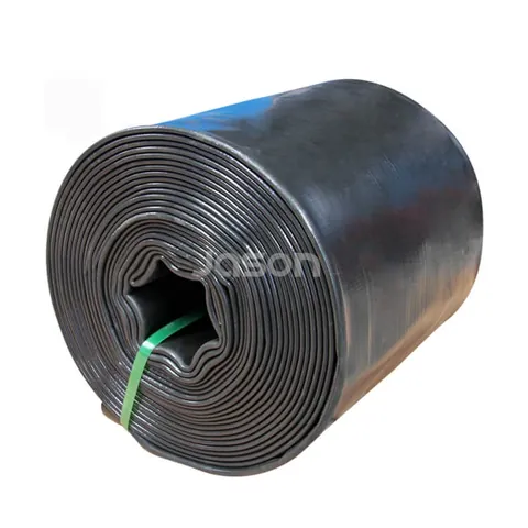 Layflat discharge hose lying flat on the ground