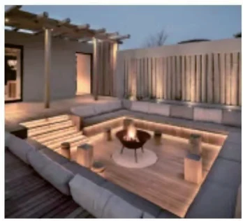 Outdoor terrace with warm linear LED lighting built into the timber structure