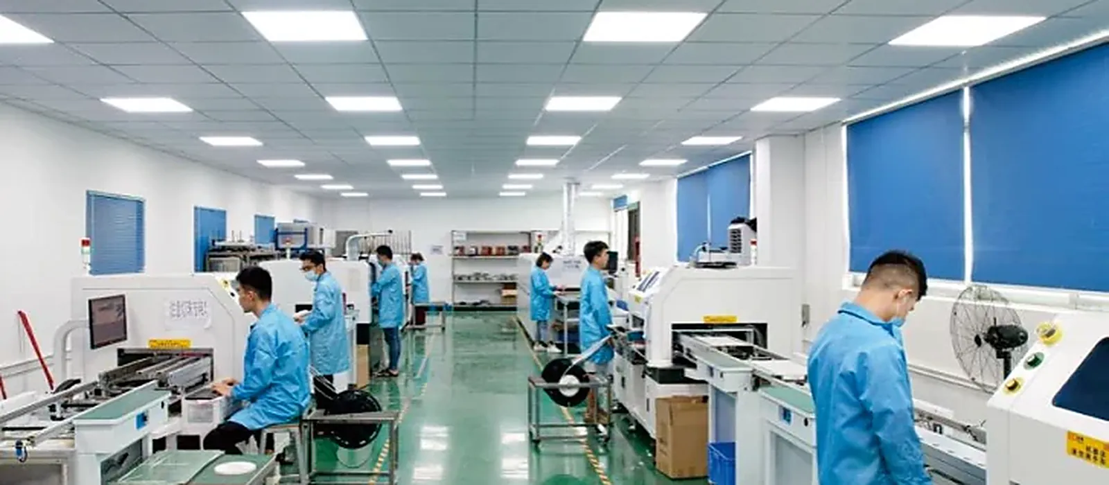 Operators testing finished LED modules on the production line in Shenzhen