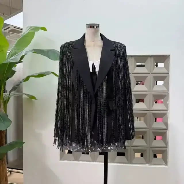 Black tailored blazer covered in crystal chain fringe with notch lapels