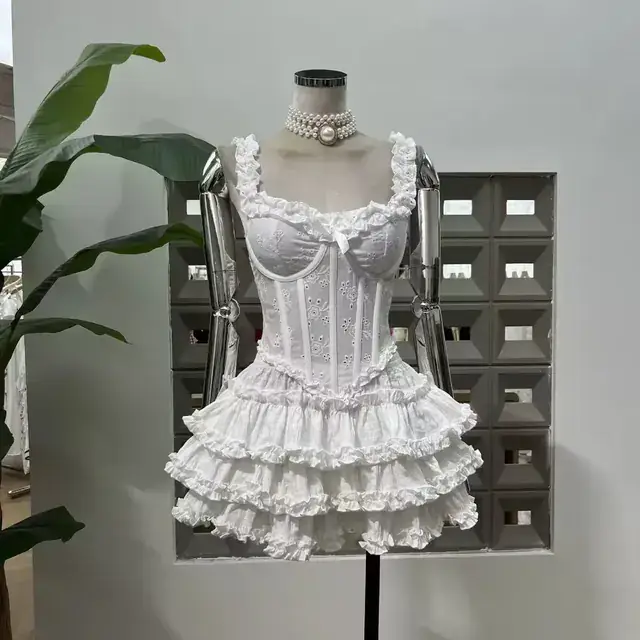 White broderie anglaise corset mini dress with three tiered ruffle skirt