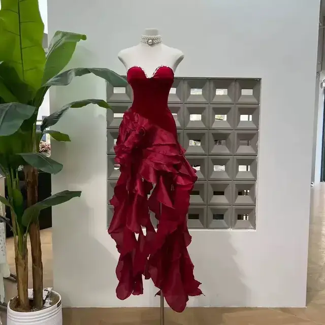 Red velvet sweetheart bustier gown with cascading organza ruffles