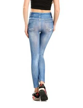 Blue washed denim look jean-legging shown full length on a model, wearing a white crop top