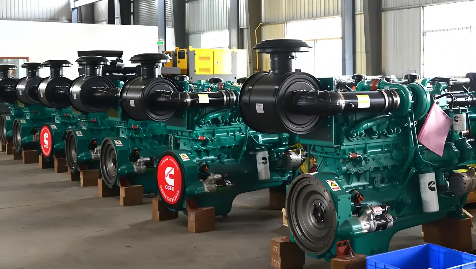 Generator drive engines held in stock, each checked against its configuration number before dispatch.