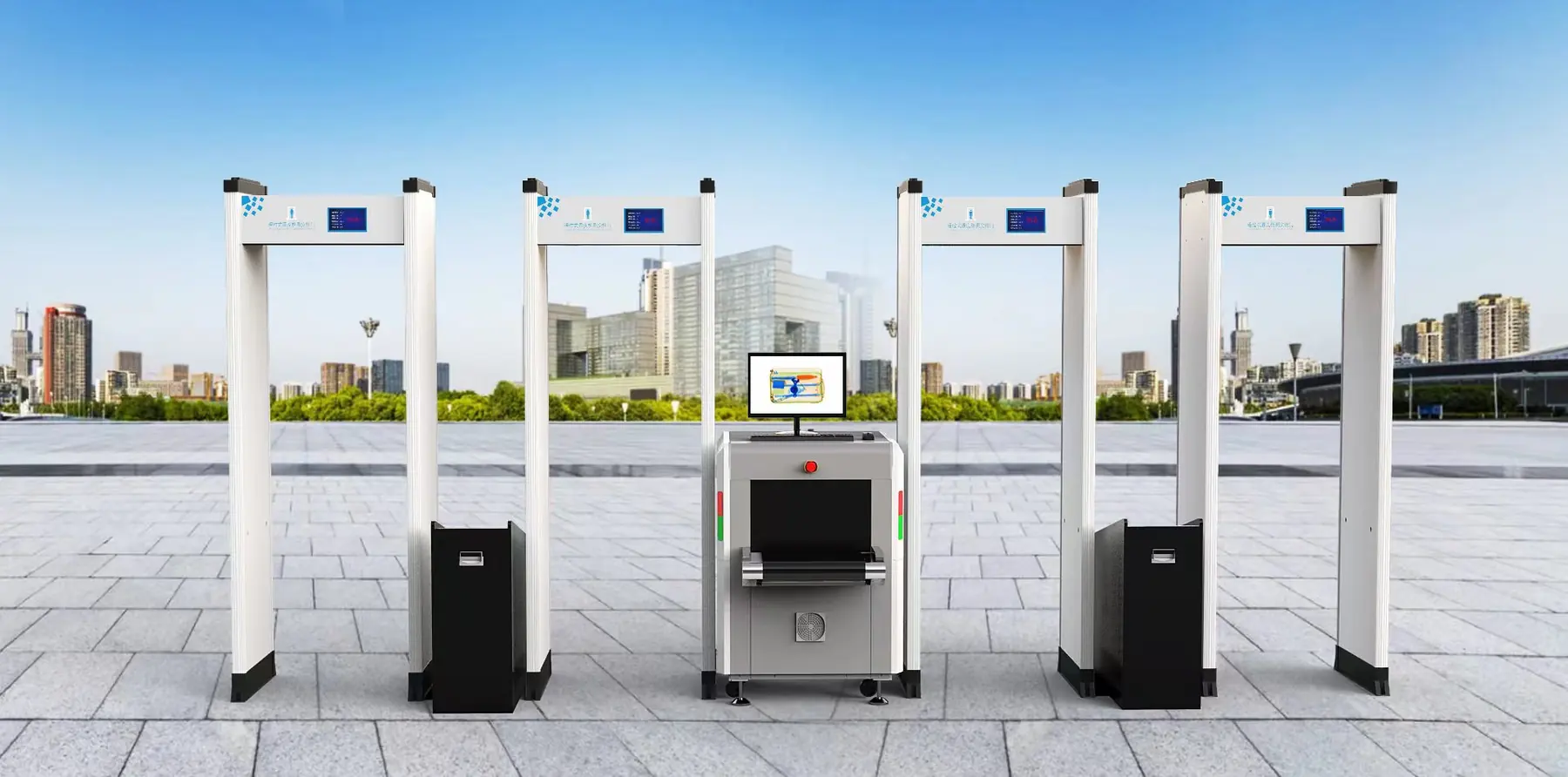 Walk-through metal detector gates installed at an outdoor public entrance.